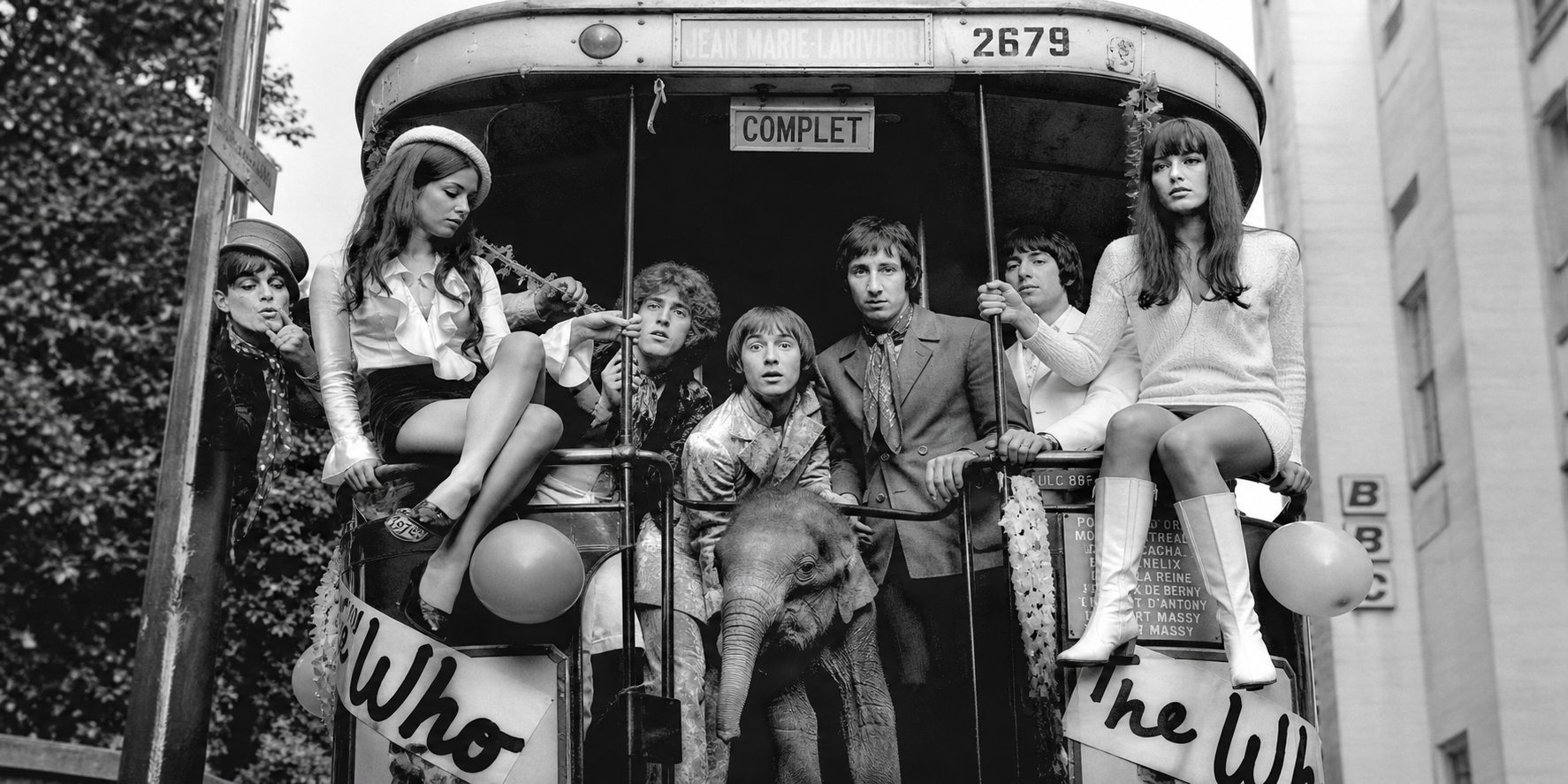 A monochrome San Francisco counterculture cable car scene.